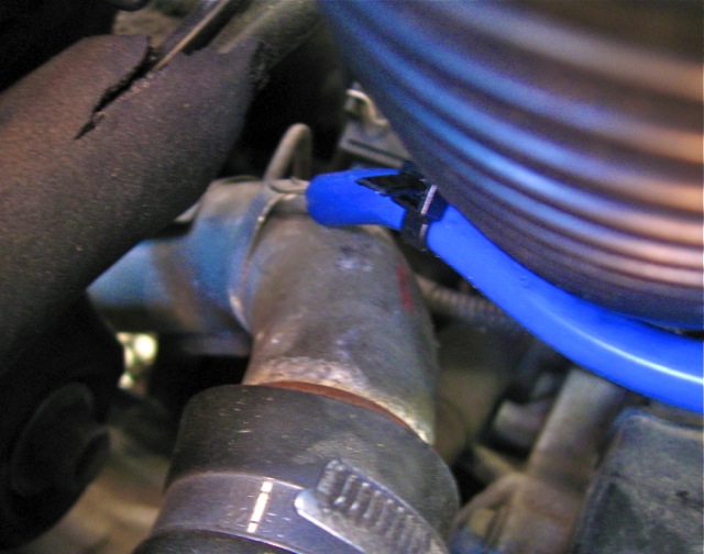 4mm ID silicone tubing connected to metal line. Black zip tie in place to hold tubing securely to line.