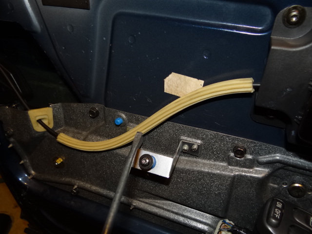 Door handle wire. remove this too. I wouldn't waste time trying to re-use. keep it in combination with the handle you may be able to sell it.