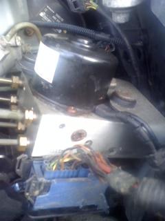 The Box is under that silver thing, but um stuck trying to separate it or dont know how to remove it