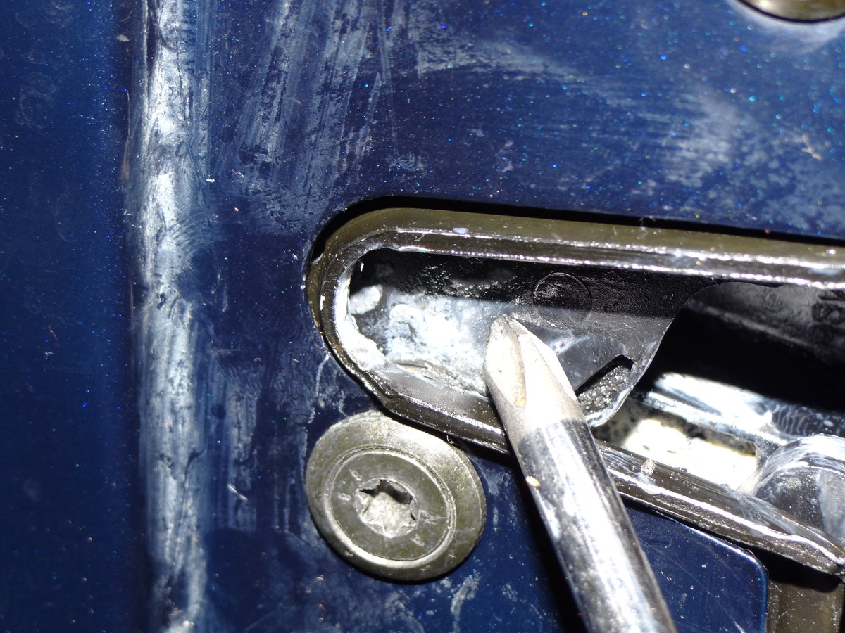 And here is what the latch and second hole(torx screw) look like with the door open.