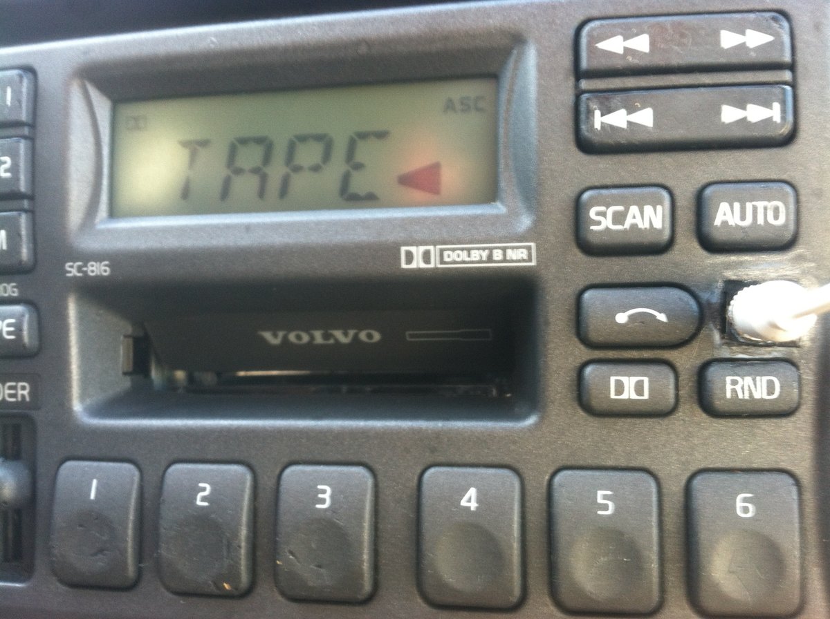 Finished and functional. DIY smartphone mount mod (via LifeHacker) below, clipped to center console. Binder clip, rubber band and yarn. Best mount ever!