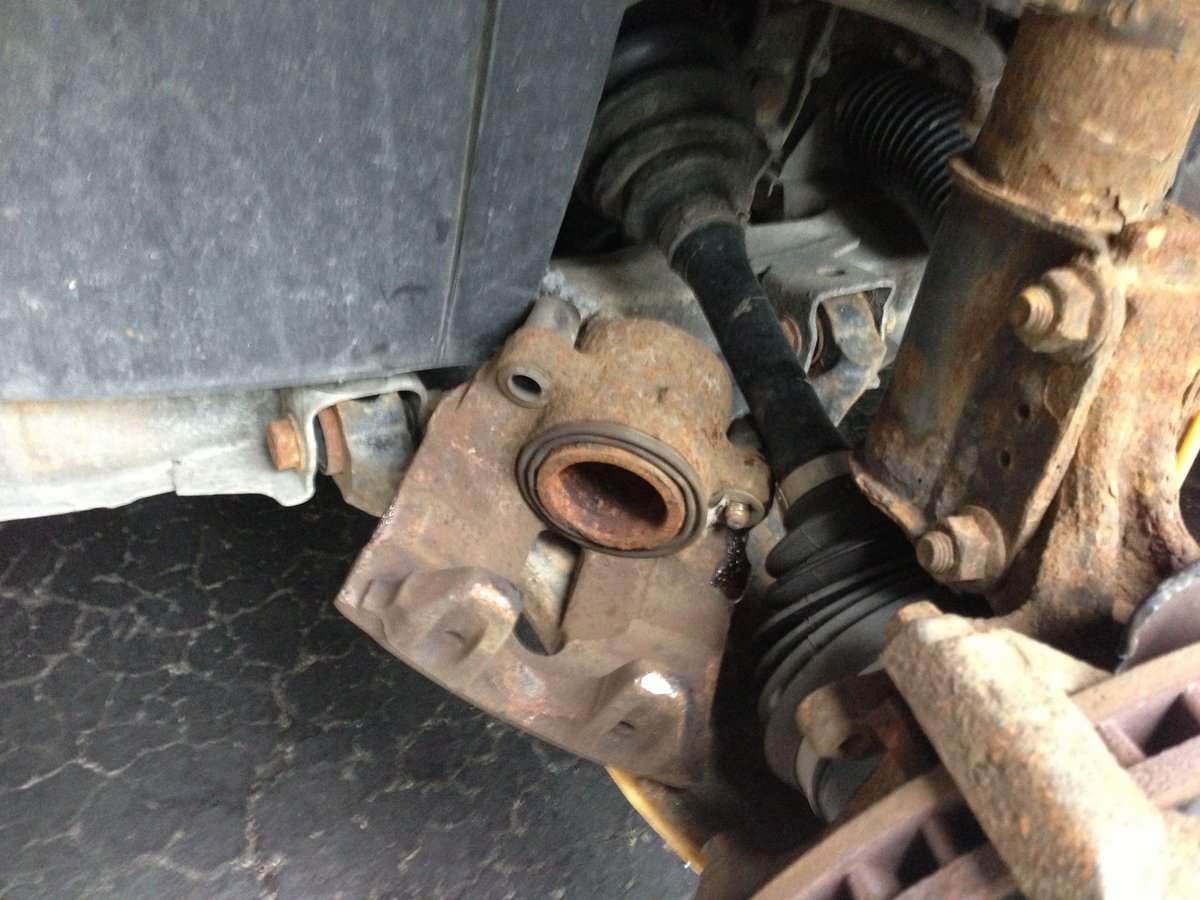 Caliper off - rest it on control arm - do not hang by brake hose!