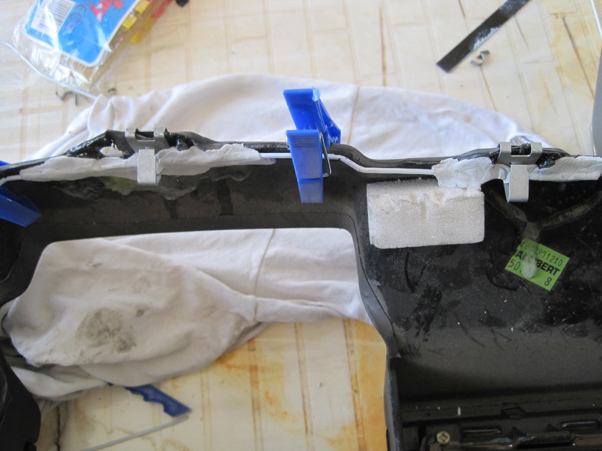 Metal wire in tab of panel