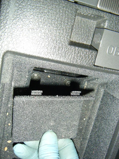 Accessing the two (2) screws