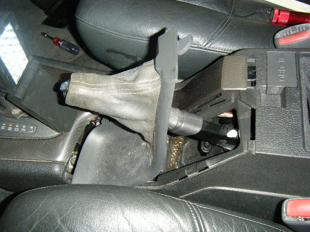 Slowly...slide it off...and carefully "pop" the rear plastic tab, then slide to the left (looking down) for complete removal...