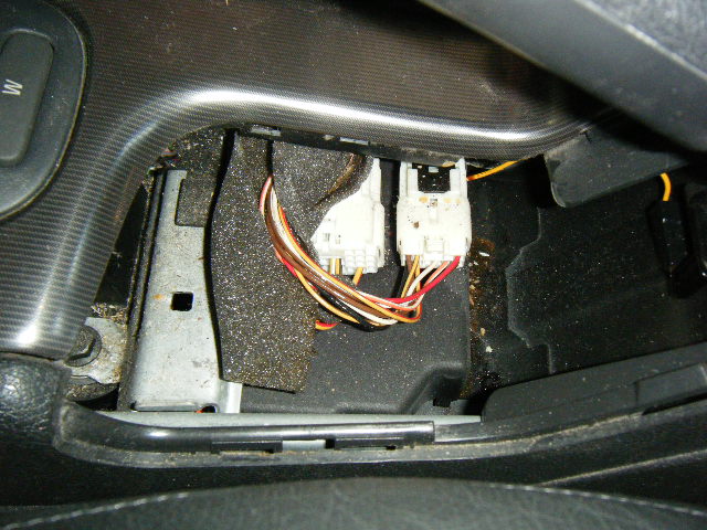 Two connectors, basically powering everything along the lower center console, must be disconnected...