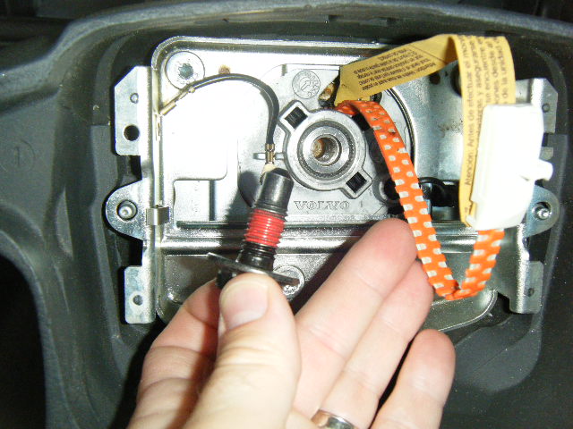 It's out...that's got to be factory red "thread locker" on there, as I don't believe it's ever been removed...