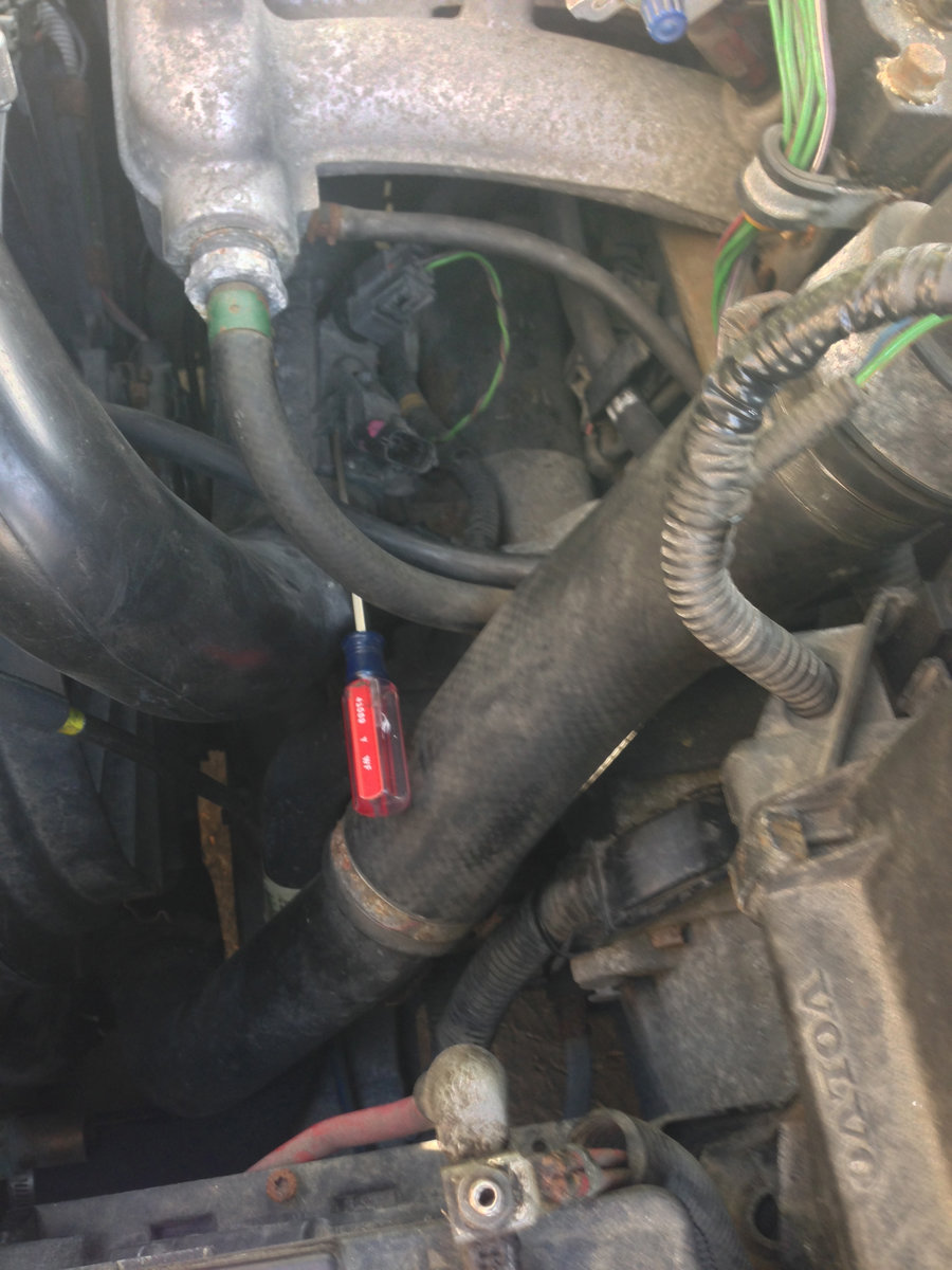 With the intake air hose removed, you can slip a small screwdriver in to release the MAP ears