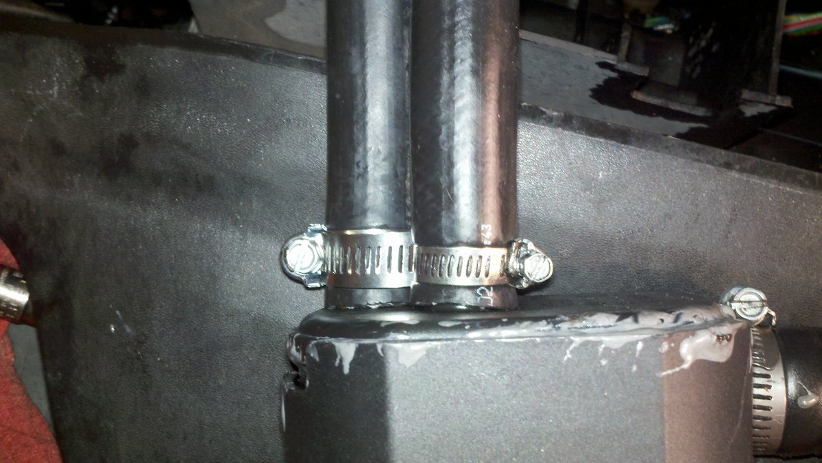 Screw clamps facing front of trap