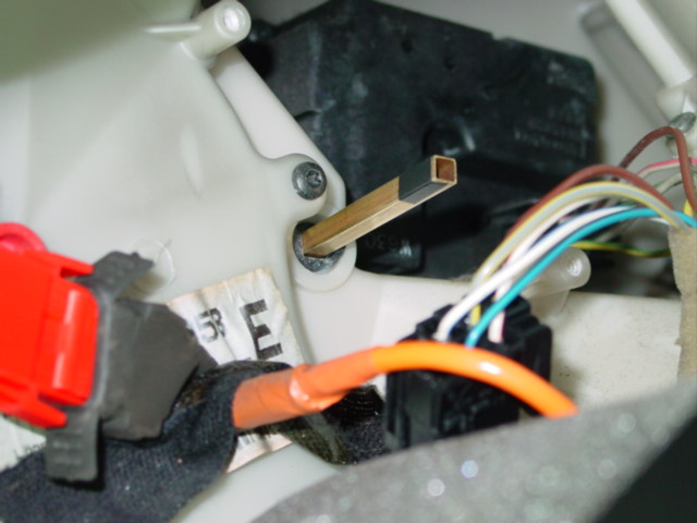 Brass tubing into Dampener plastic.  Note electrical tape on motor end of "shaft."