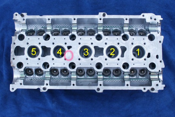 Spot where cam cover hole meets on turbo cars and newer Volvo heads.