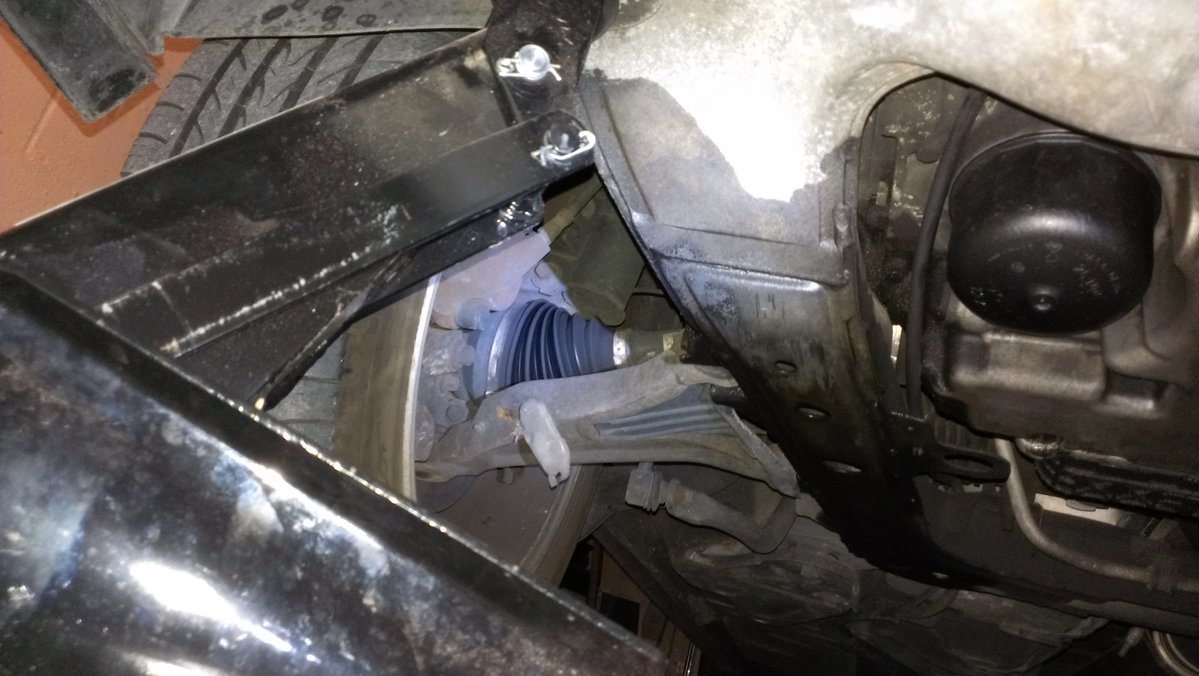 under the car - don't worry, i wasn't under it without jack stands....