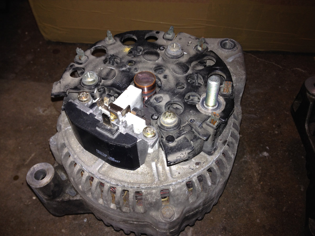 Aftermarket version of Bosch 1-197-311-520 voltage regulator, installed.