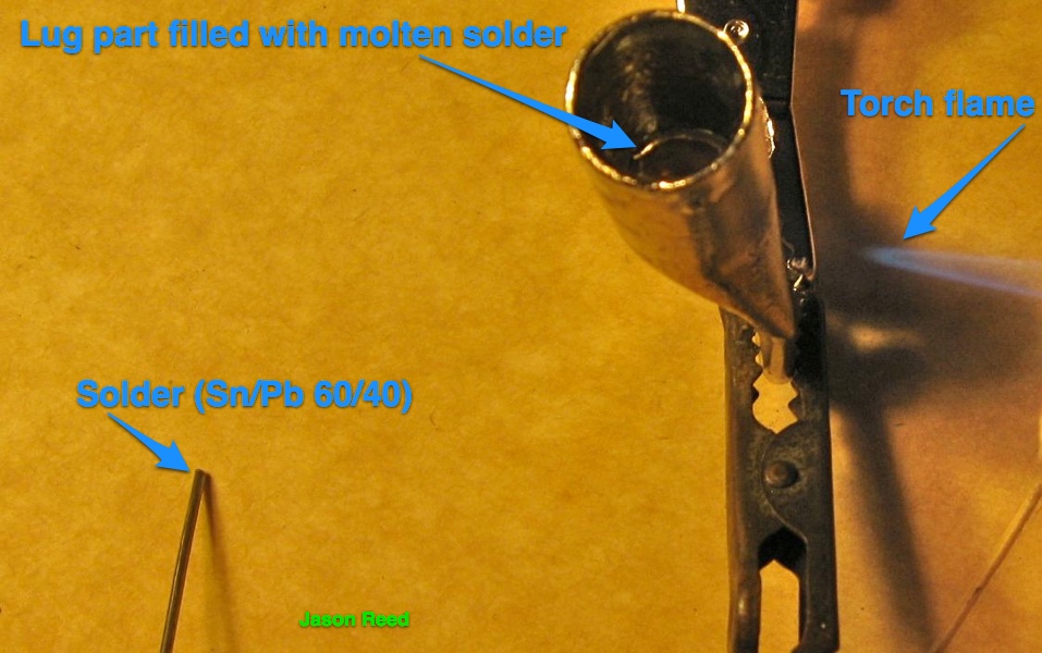 Using torch to heat lug and melt solder