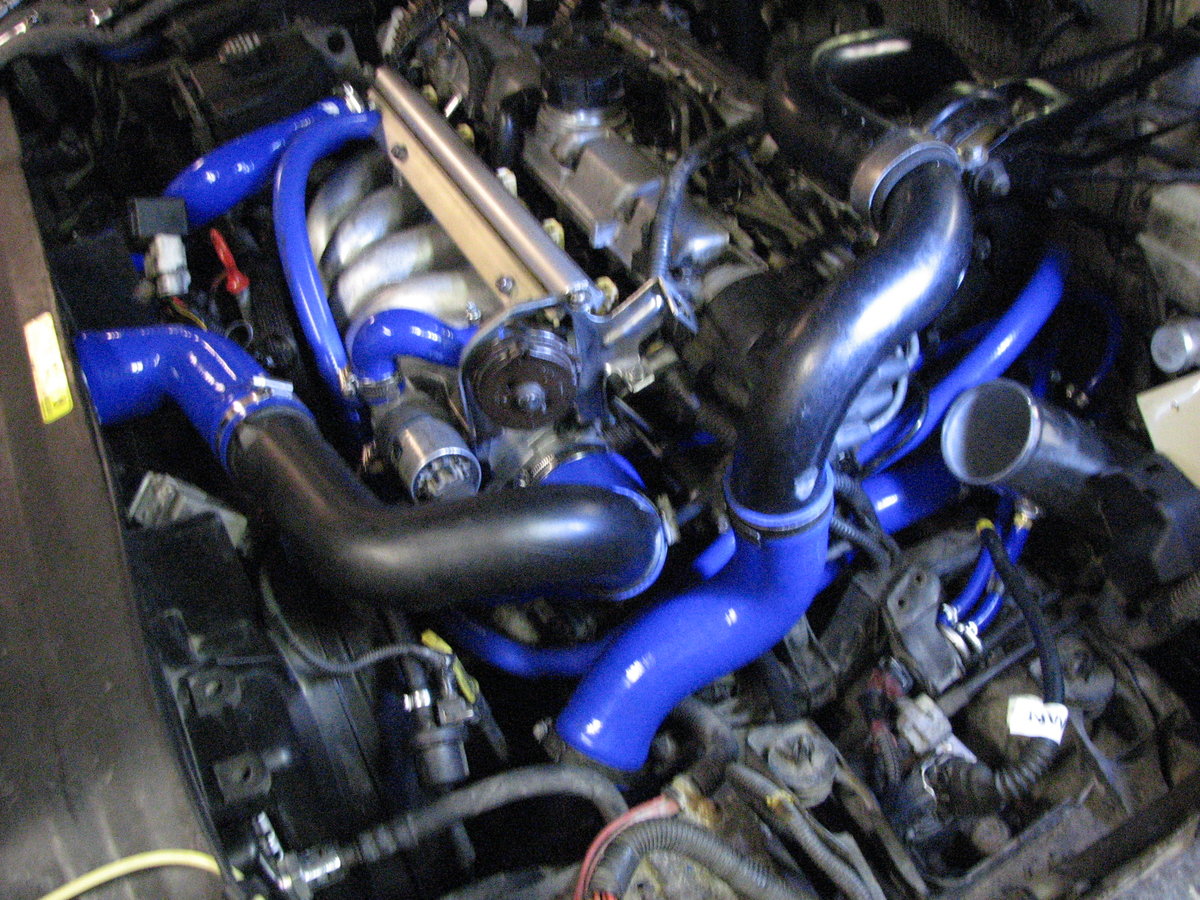 The N/A manifold is larger and things became tight with 3" hoses.