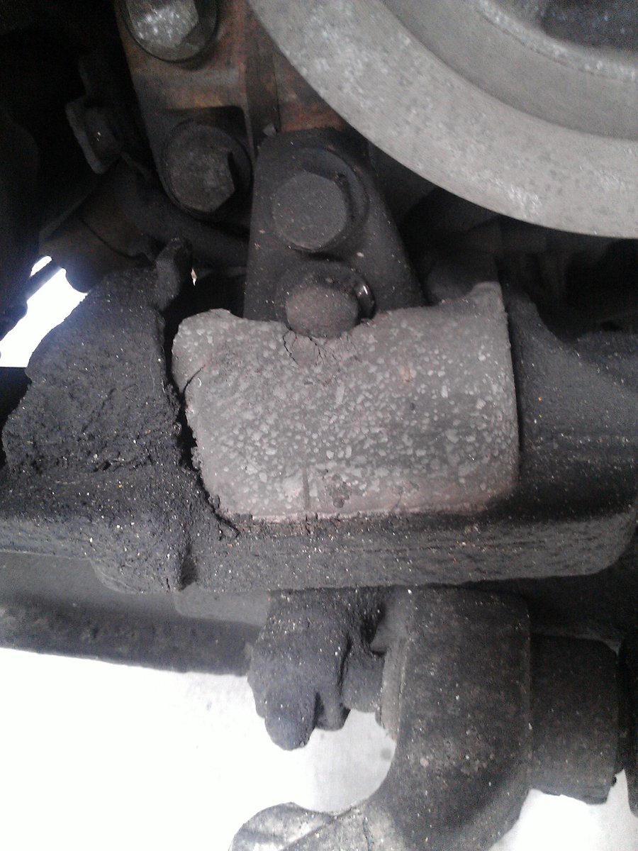 As you can see the mount is completely collapsed.  I had to get a wood chisel and carve away the rubber to get to the lower bolt!