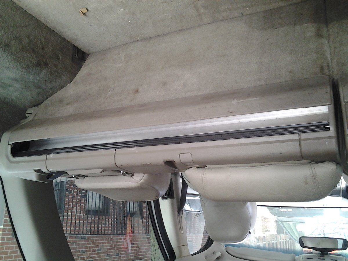 Seatback of right rear seat with cover removed, showing void