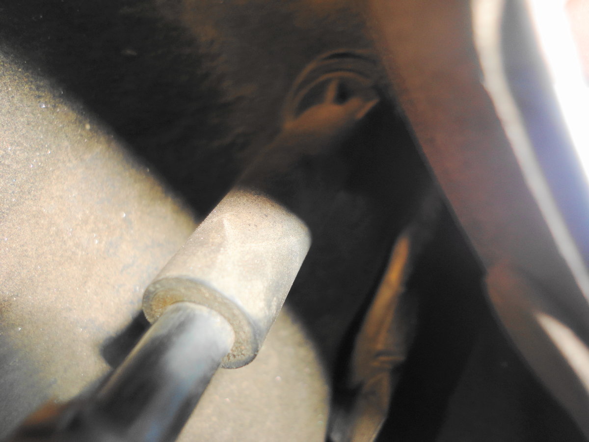 Where fuel filler vent tube enters fuel tank.  Very difficult to gain access.