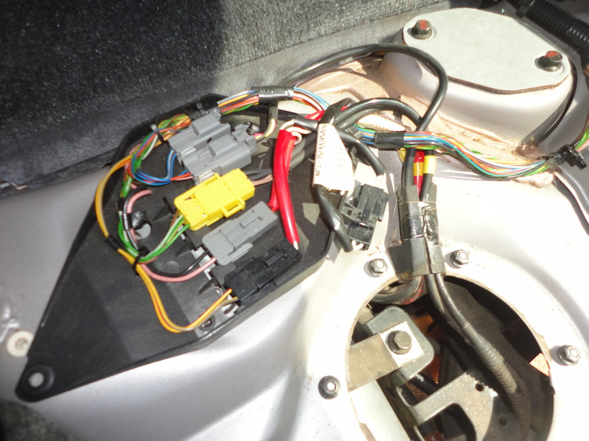 Second access panel is under wiring harness (held in place by plastic clips at either side).