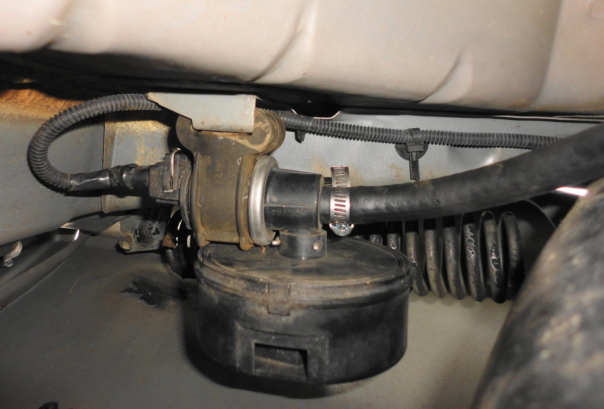 Old hose replaced with 3/8 fuel injection hose and clamp.