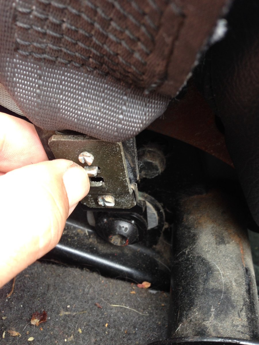 Lift front of switch plate, then remove. Push in tab w/thumbnail