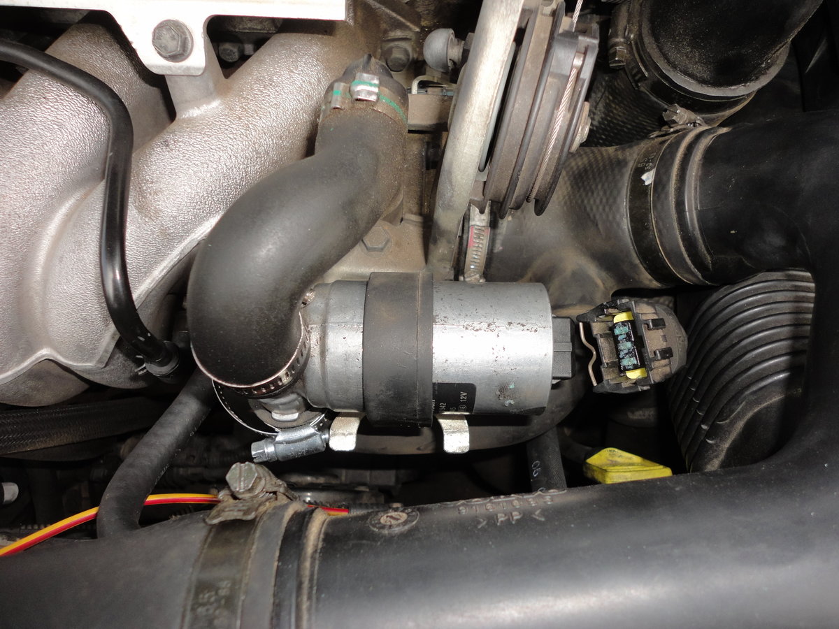 Unplug TPS and remove upper and lower hoses.