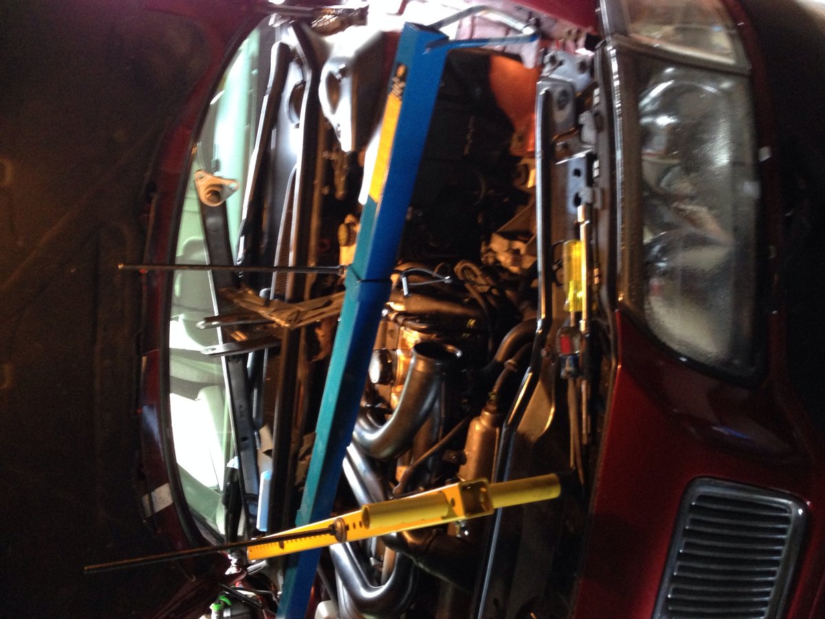 FWD engine lowering tool from Astro Pneumatics, about $70 on Amazon.  Used the braided steel cables that came with it, one looped around the intake manifold, the other wound around the engine-to-subframe mount.