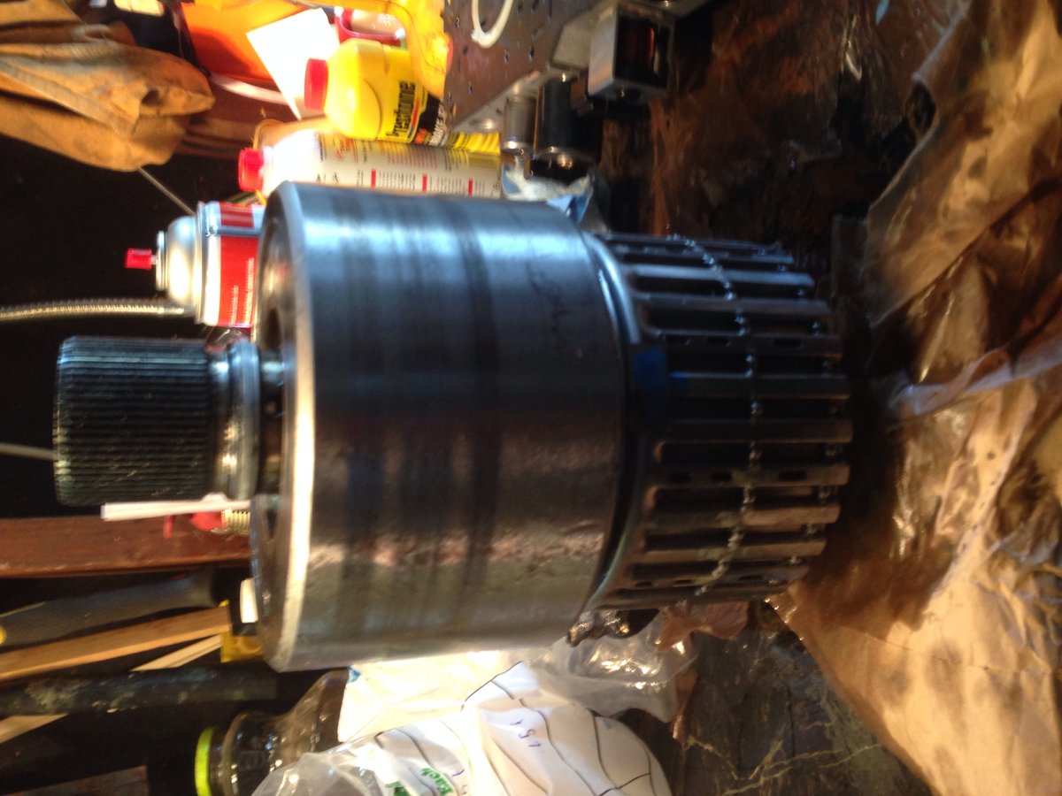 Input clutch, 3rd gear clutch, 2nd gear clutch and apply drum all standing on top of the sprag and short splined shaft to engage the planetary all assembled as one stack for installation past the installed reverse band.  Remember that all of the rebuild manuals / videos assume you have the transmission out, in a fixture and facing down for this procedure, which I did not.  Lining things up otherwise is very difficult so I used this method.