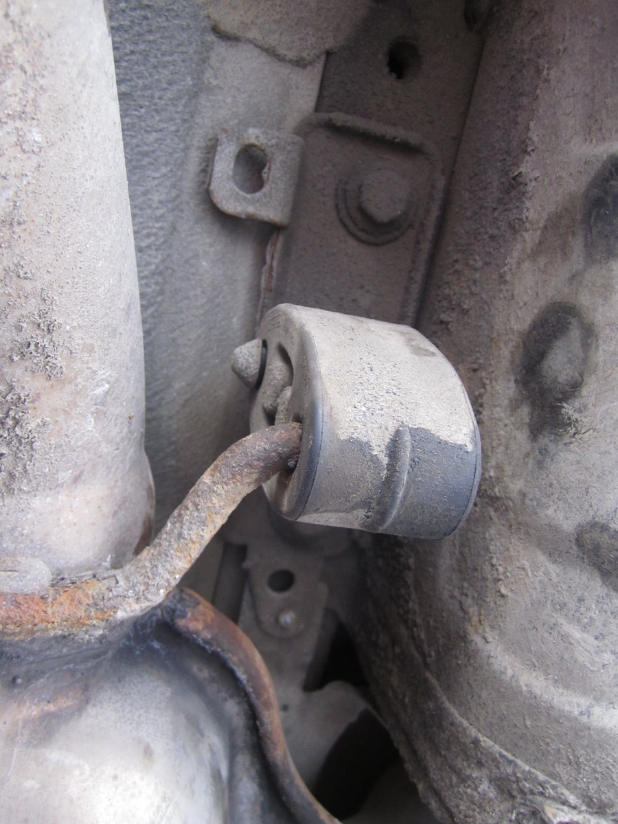 Rear muffler box mount looking up from underneath rear of car