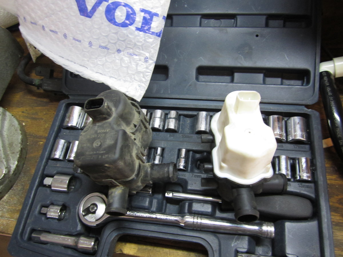 Old and new pumps, with new pump pipes removed