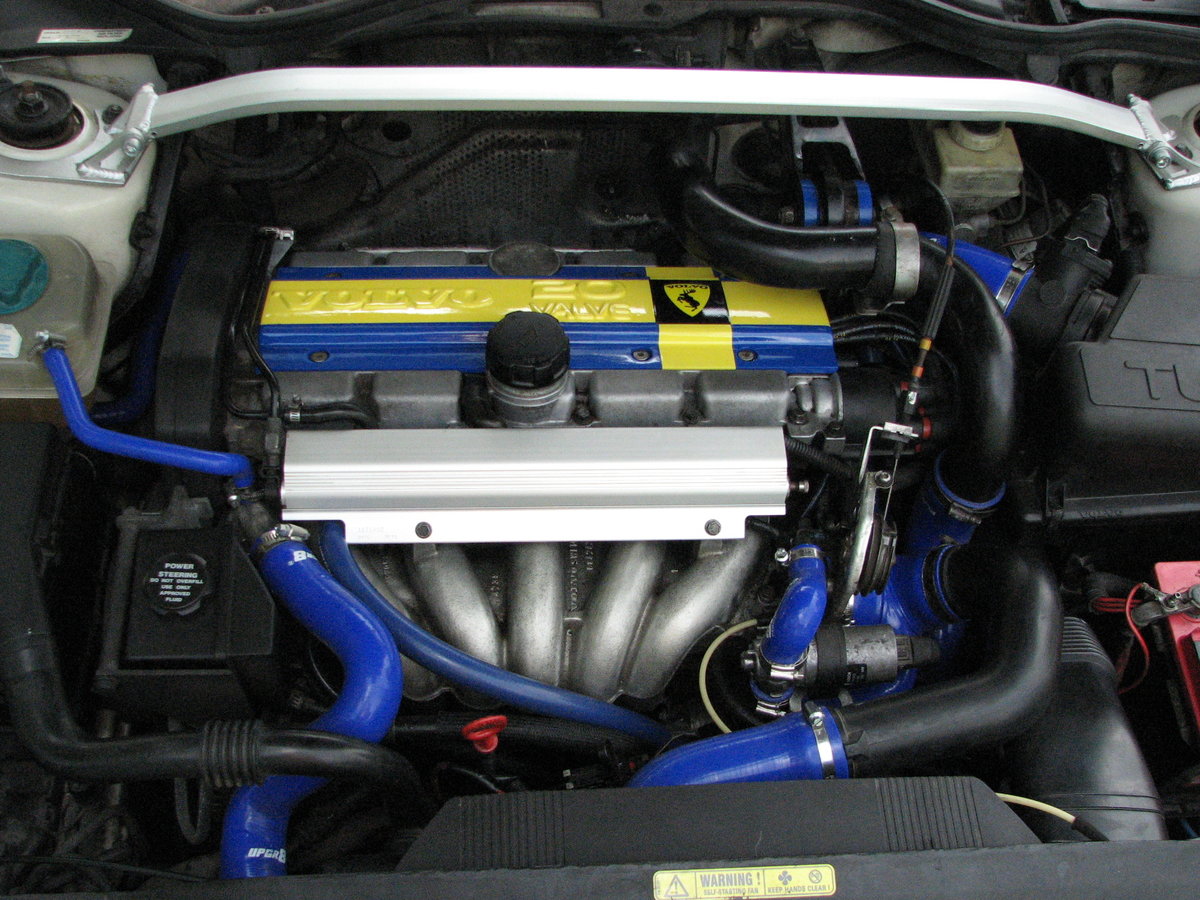 "5/8 heater hose is coming around front of the manifold from next to the radiator hose