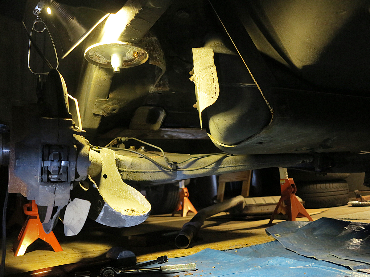 Driver's side rear - spring and shock removed - broken exhaust lay on ground