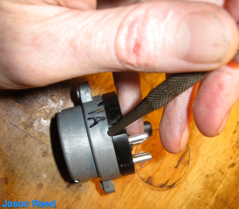 Staking the metal tabs back into place to lock cases together