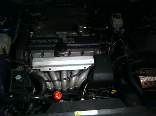 You can see the line going over the top of the manifold and running underneath to the pass. side.