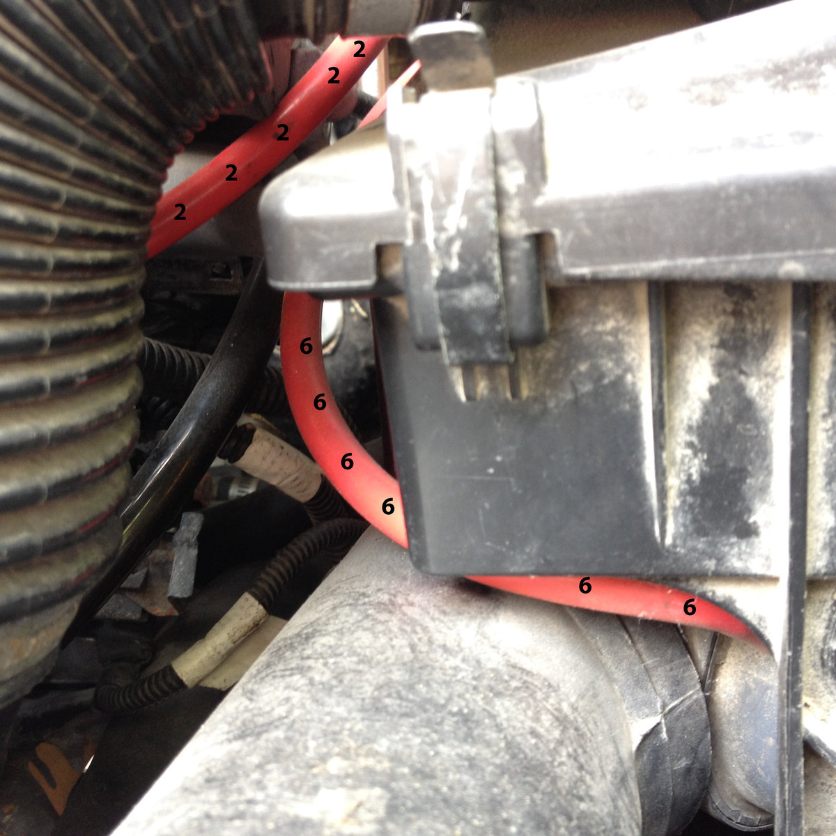 Line 6 viewed from the front of the car, attaching to the air box stat just out of view in the lower right