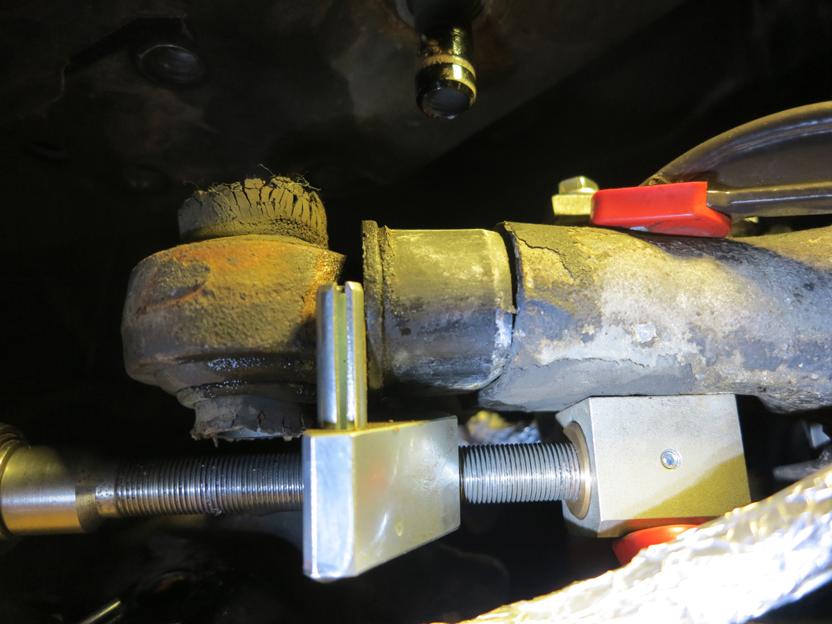 spray bushing with soapy water first...and then turn - it pops out, no heat was necessary