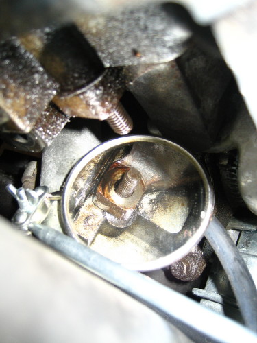 Oil seen coming from stud.  That's a mirror placed opposite the stud.  It's hard to see from the photo, but the stud itself is covered in oil, and typically has a drop at the end of it.