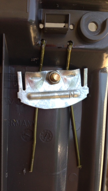 Top of armrest frame, not seen when fake leather cover is attached.