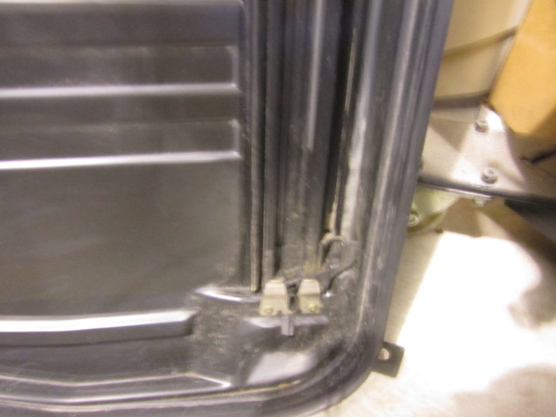 Rear RH corner of tray.