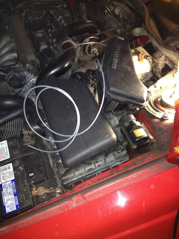 Feed vacuum line into engine bay from inside the car