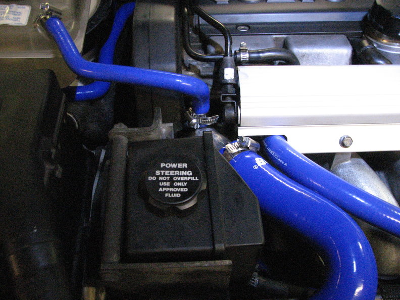 Expansion tank, top radiator, and 5/8" heater hose from oil separator to PTC at turbo intake.