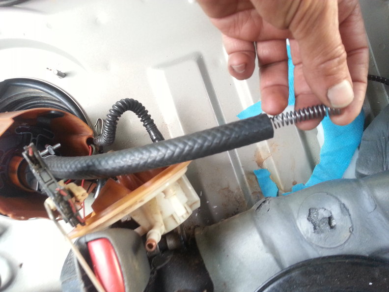 Insert stiffening spring (you can use twice the spacing I used to have a more flexible hose)