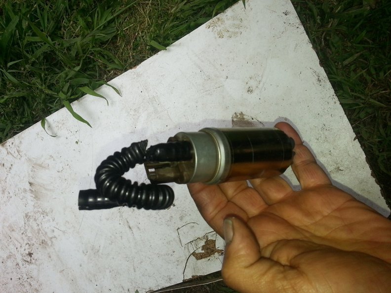 The original hose can't be removed without breakage.  I used a Stanley knife to slice it carefully