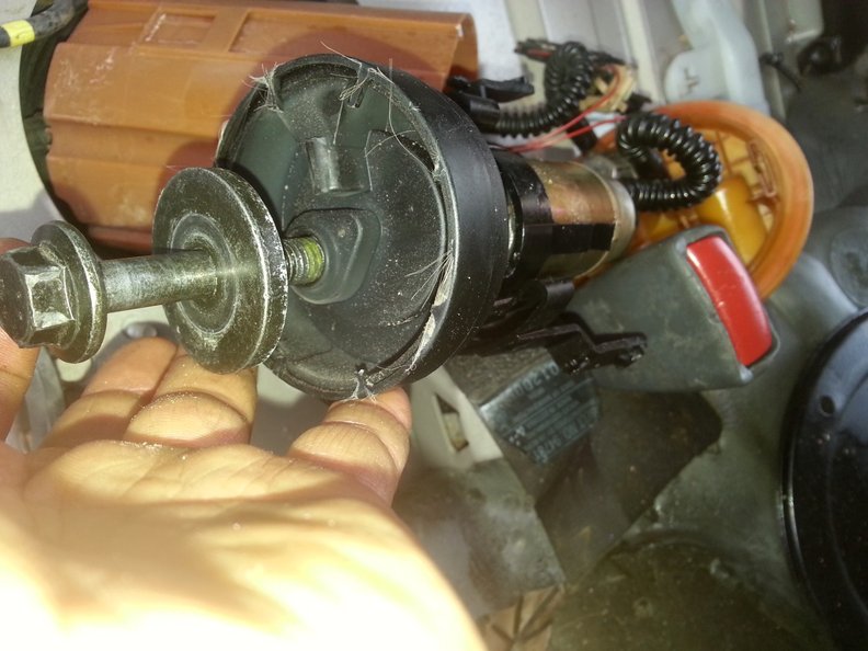 Forcing the old pump out with a 1999 plus axle bolt (end of pump is metal)