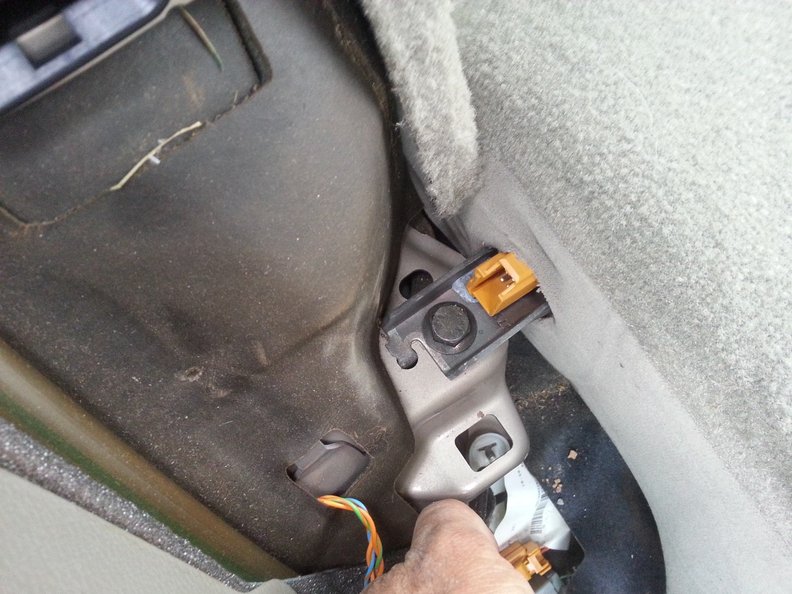 Remove this 14mm bolt in order to remove the large seat backrest