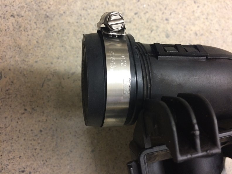 Slide plug / cap over the warm air intake port and secure with hose clamp (commonly comes with the cap).