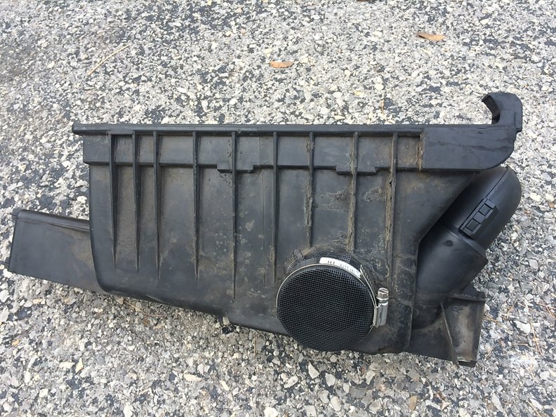 Use common fiberglass screen material, use a coffee can or similar to cut it in the shape of a circle larger than the cool air intake port, place it over the port and secure it with a hose clamp. IMHO you've now got a safer for your engine high performance airbox. Reinstall with a clean filter and enjoy.