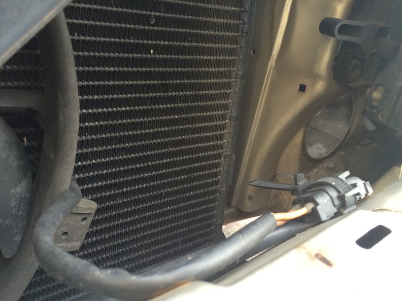 With the snorkel and its base removed you'll get loads of cool air easily reaching this huge air intake port. Because this big air port is behind the headlight no big debris will ever enter the airbox (or clog the snorkel) so the air filter's flow and filtration efficiencies should be improved.