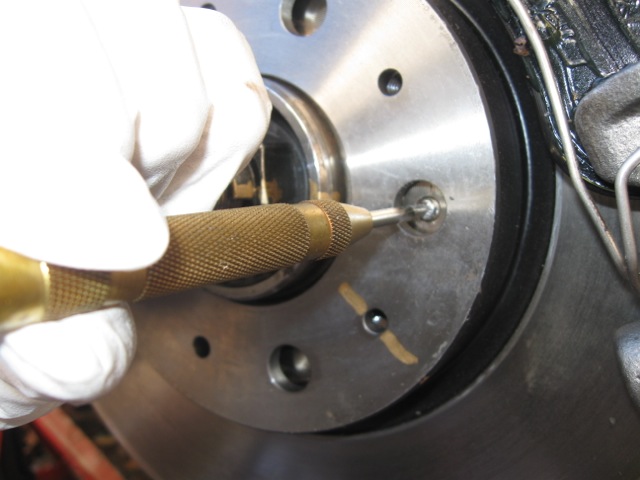 Strike a divot in the exact center (as close as you can get)