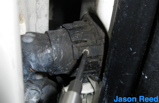 Loosen and remove T10 on electrical connector.jpg